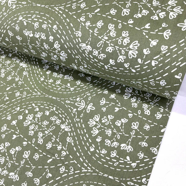 Sage green floral fabric featuring a white floral vine and dotted trail print, ideal for quilting, dressmaking, patchwork, crafts and home décor.