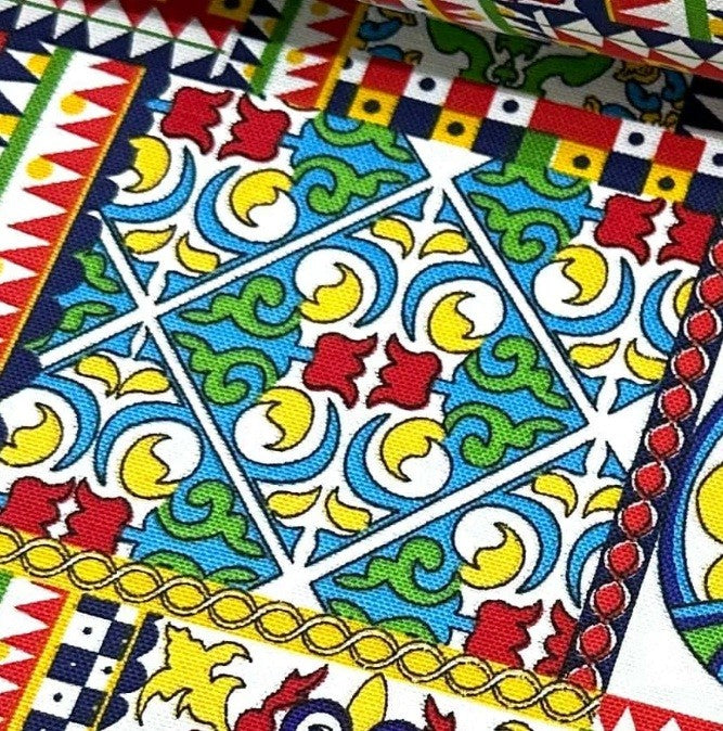 Sicilian tile fabric in floral moroccan designs in yellow red blue green white. 