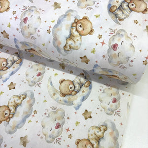 Sleepy teddy bear 100% cotton poplin fabric featuring teddy bears on crescent moons and fluffy clouds with stars on a white background.