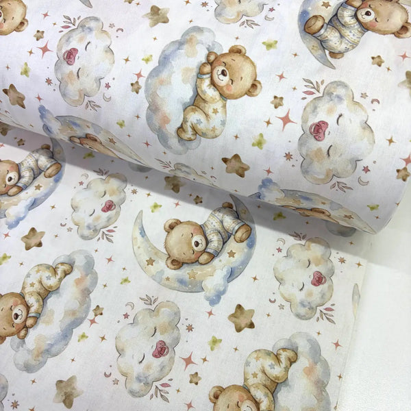 Sleepy teddy bear 100% cotton poplin fabric featuring teddy bears on crescent moons and fluffy clouds with stars on a white background.