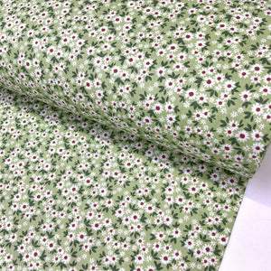 Small print green and white daisy flower 100% cotton fabric with a ditsy floral pattern, ideal for quilting, dressmaking, patchwork and crafts.