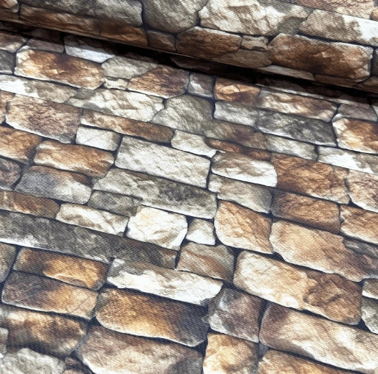 Cotton upholstery fabric patterned with stone wall with natural stone texture.
