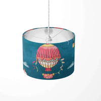 Decorative ceiling lampshade with hot air balloon design on a dark blue background.