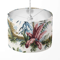 Tropical palm leaf patterned lampshade on a white background.