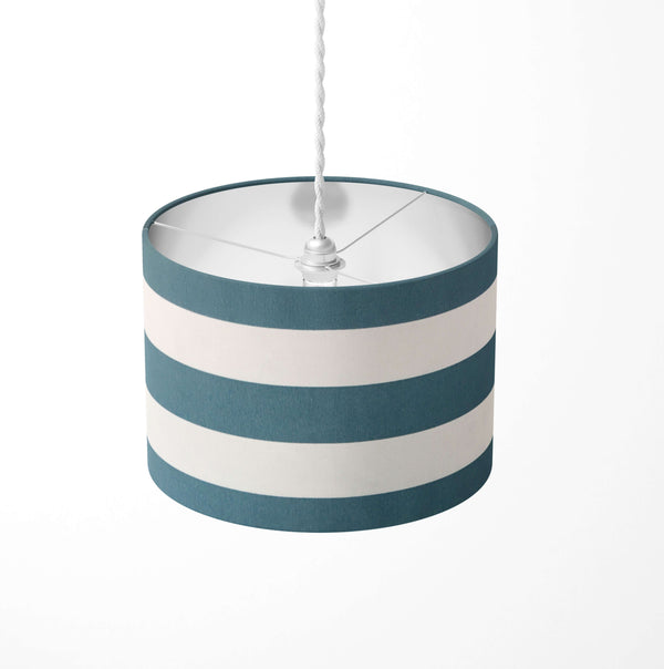 Striped ceiling lampshade with petrol blue and white stripes on a white background.