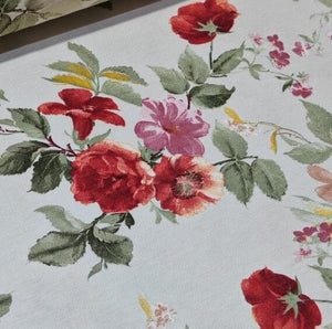 Vintage style red pink flowers and sage green leaves patterned cream upholstery curtain fabric.