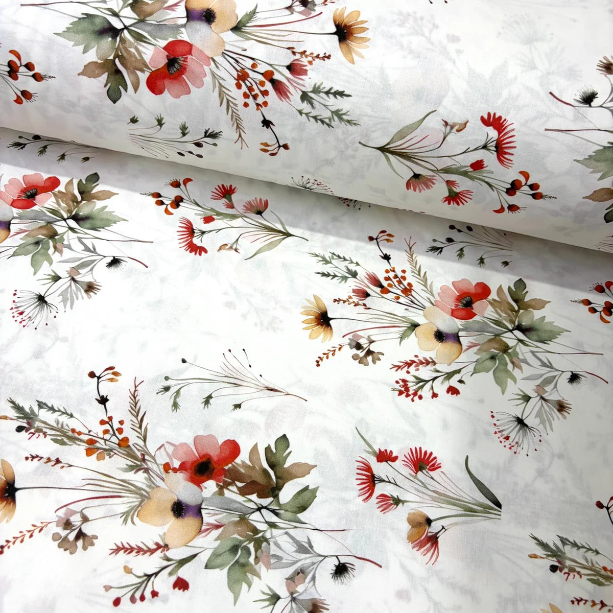White cotton poplin fabric featuring watercolour red flowers, botanical foliage and country cottage floral bouquets, ideal for dressmaking, quilting, patchwork and craft projects.