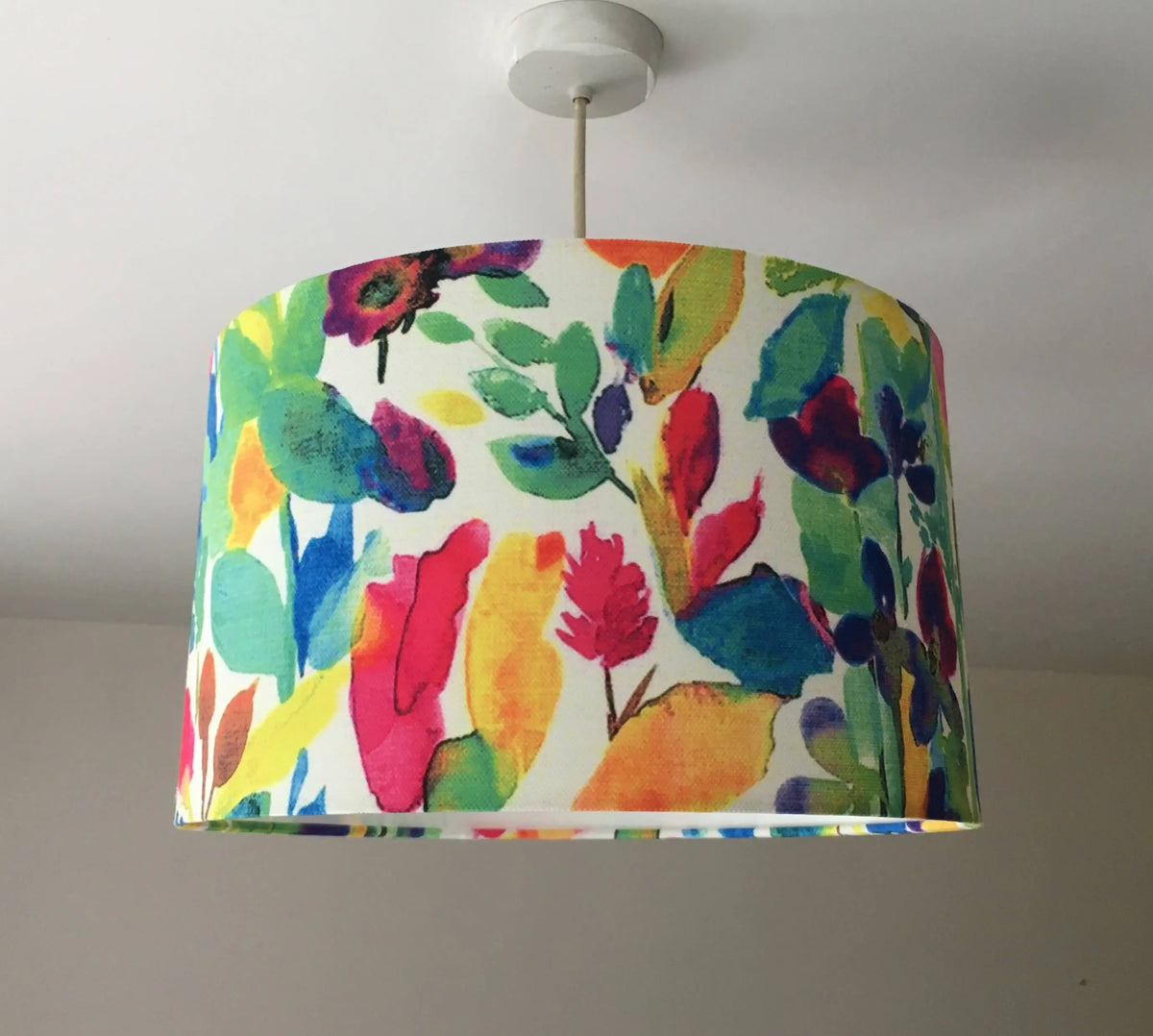 Rainbow floral-patterned contemporary ceiling lampshade hanging against a plain background.