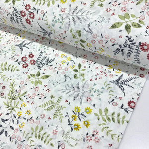 Wildflower botanical cotton fabric featuring green foliage and burgundy, yellow and grey flowers on a white background.