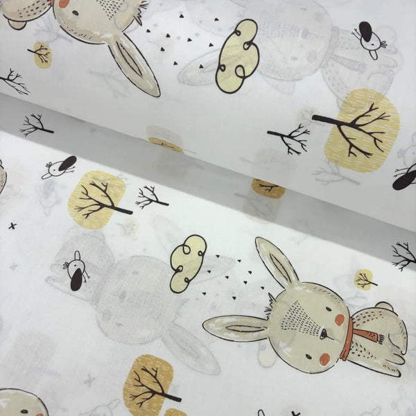 Children's woodland fabric with bunny and tree pattern on a white background.