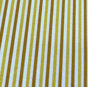 Close-up of cotton canvas upholstery fabric with mustard yellow and white striped pattern.