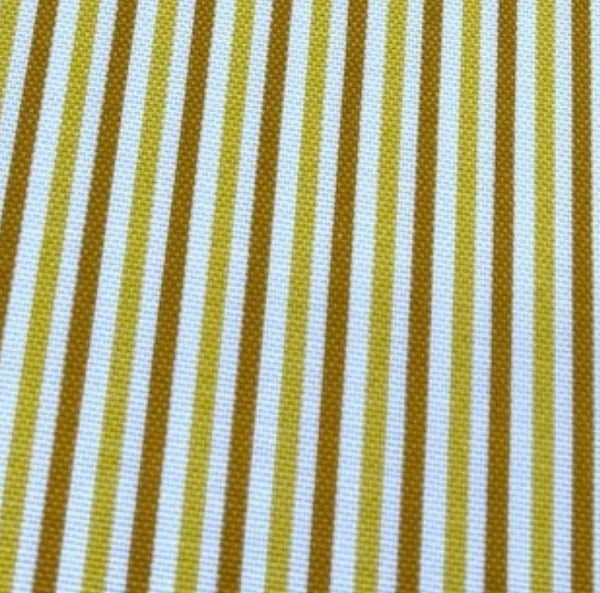 Close-up of cotton canvas upholstery fabric with mustard yellow and white striped pattern.