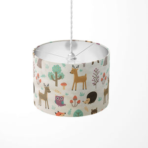 Woodland animal print ceiling lampshade featuring fox, rabbit, reindeer, bear, owl, tree and mushroom patterns.