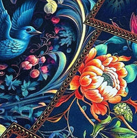 Navy blue art print tapestry upholstery fabric patterned with orange flower and blue phoenix.