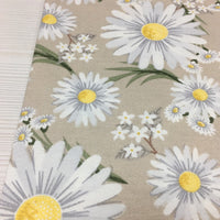 White yellow daisy flower print beige upholstery fabric.