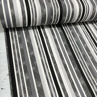Black, grey and white monochrome striped fabric with various shades of grey, suitable for upholstery or curtain use.