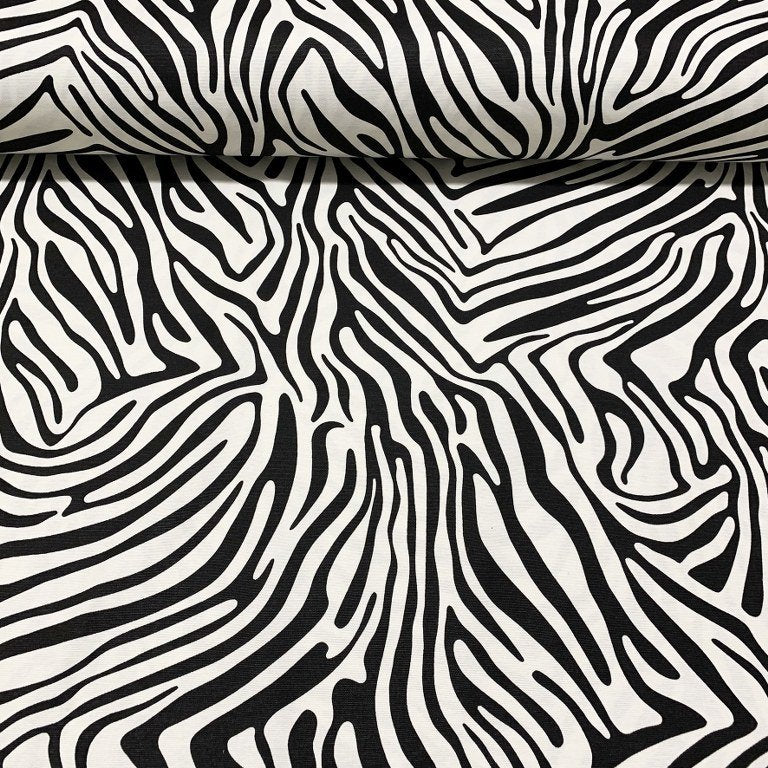 Cotton canvas upholstery fabric patterned with black and white zebra stripes.