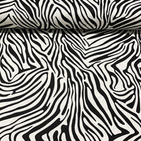 Cotton canvas upholstery fabric patterned with black and white zebra stripes.