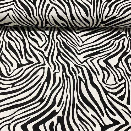 Cotton canvas upholstery fabric patterned with black and white zebra stripes.