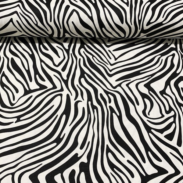 Cotton canvas upholstery fabric patterned with black and white zebra stripes.