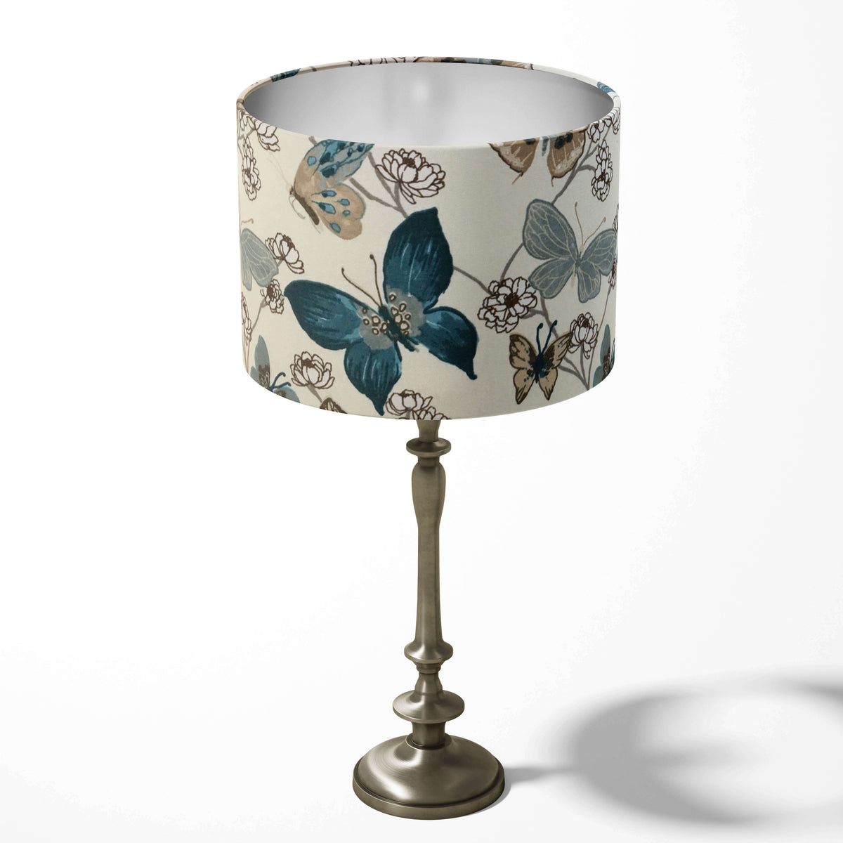 Teal blue table lampshade with animal print and floral pattern on a white background.