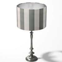 Vertical large stripe grey and white table lampshade on a white background.