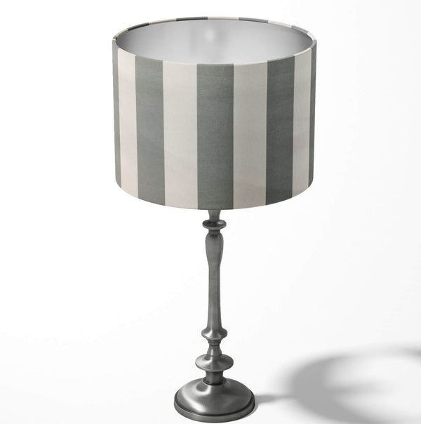 Vertical large stripe grey and white table lampshade on a white background.