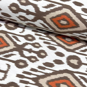 Uzbek moroccan ikat patterned upholstery fabric with geometric design in brown, rust, and beige on a white background. 