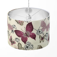 Nature lampshade with pink, burgundy and beige butterfly and white flower design on a white background.