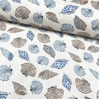 Upholstery curtain fabric with blue and brown sea shell pattern on a white background.