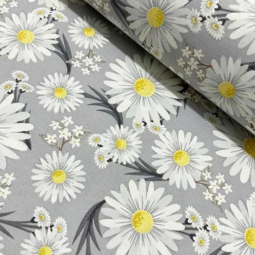 Vintage style yellow white daisy flower upholstery fabric on grey background.
