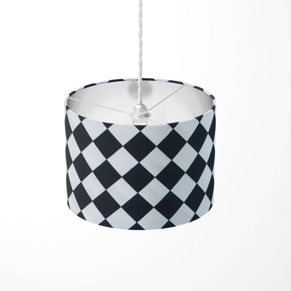 Black and white ceiling lampshade with diamond pattern.