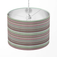 Horizontal striped lampshade with bugundy, pink, beige and brown stripes on a white background.