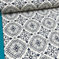 Geometric moroccan ethnic patterned upholstery curtain fabric in grey and white.