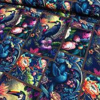 Painting upholstery curtain fabric patterned with exotic birds, flowers in red, blue, green, yellow, purple, navy and black.