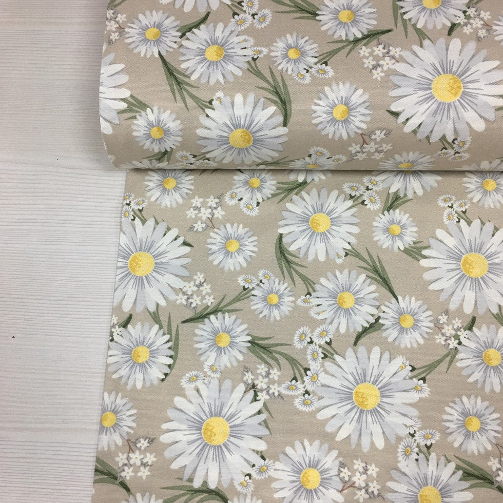 Shabby chic yellow white daisy flower upholstery fabric on beige background.