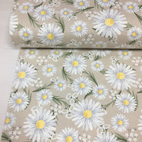 A beige floral fabric with a pattern of yellow white daisies, for upholstery, curtain making and home decor crafts.