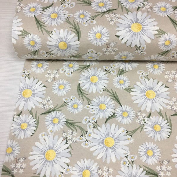 A beige floral fabric with a pattern of yellow white daisies, for upholstery, curtain making and home decor crafts.
