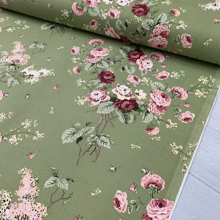 Pink and burgundy roses on moss green fabric. Shabby chic olive upholstery fabric.