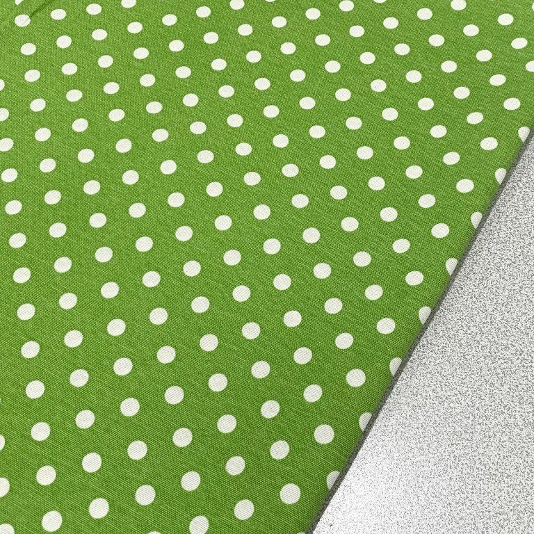 Pistachio green polka dot fabric with white spots for upholstery, soft furnishing and home decor