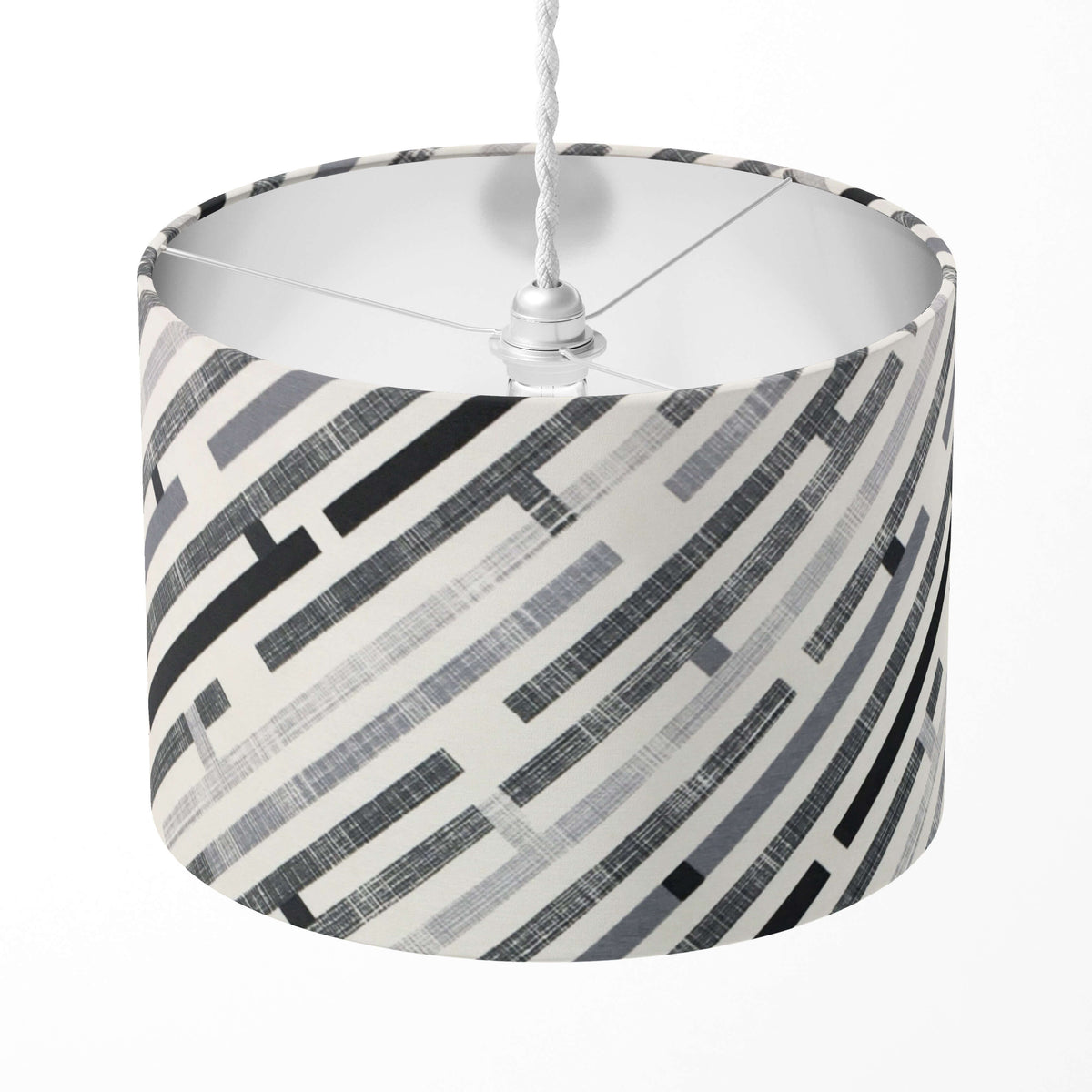 A grey stripe lampshade with a black and white geometric maze pattern, designed for table andfloor lamps, or ceiling pendants.