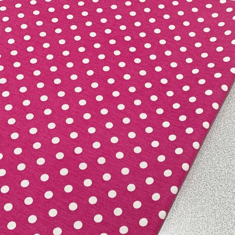 Hot pink cotton canvas upholstery curtain fabric with white spots on it