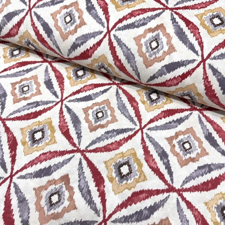 Burgundy mustard and grey geometric ikat patterns on white cotton canvas upholstery fabric