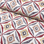 Burgundy mustard and grey geometric ikat patterns on white cotton canvas upholstery fabric