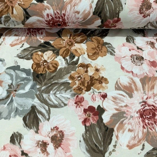 Large print brown pink flowers and khaki leaves on cream upholstery fabric. 