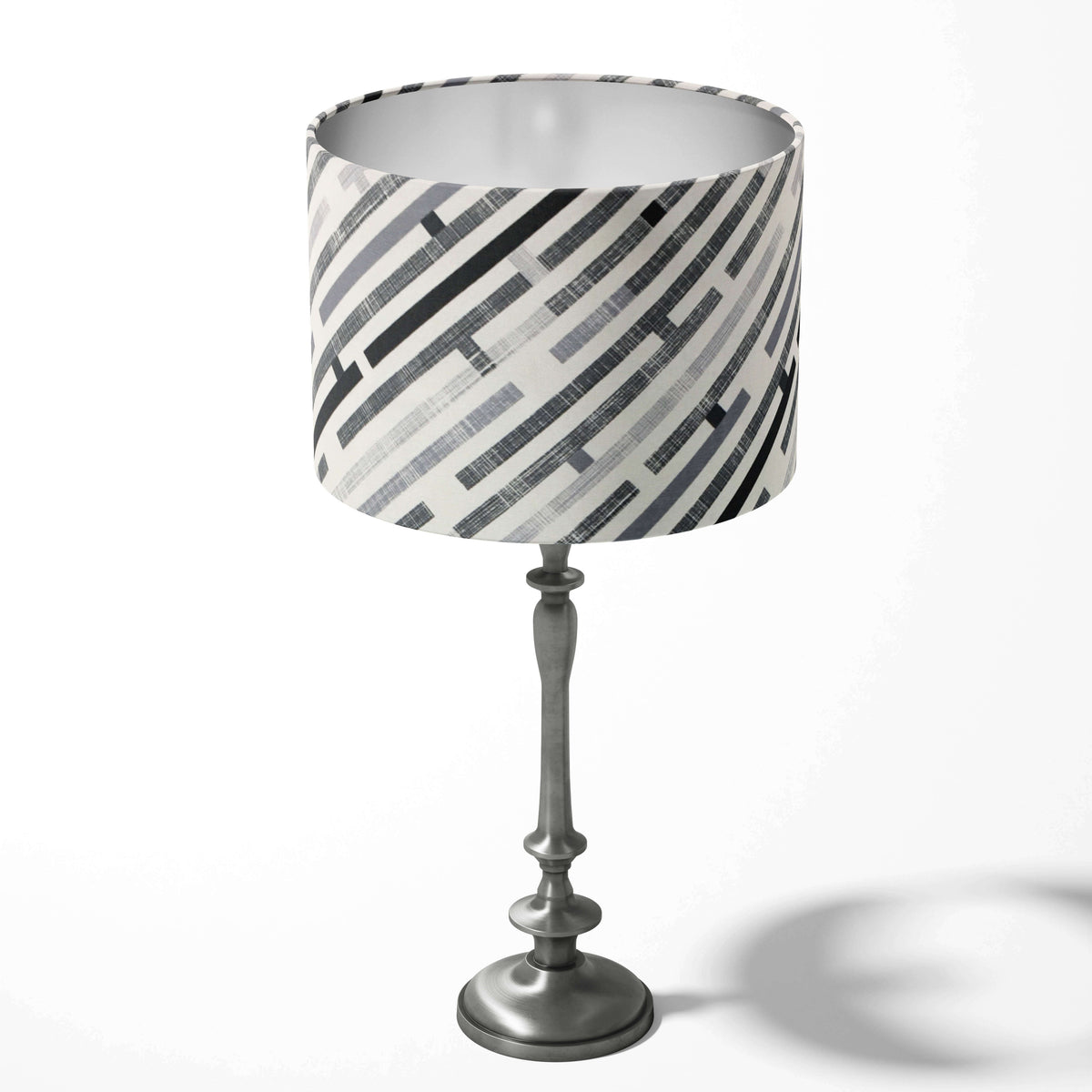 Modern monochrome table lampshade with a maze stripe pattern on a white background.