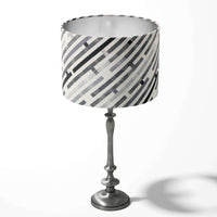 Modern monochrome table lampshade with a maze stripe pattern on a white background.