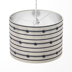 A cylindrical drum lampshade featuring navy white stripes with rope knot details, suitable for table lamps, floor lamps, or ceiling pendants.