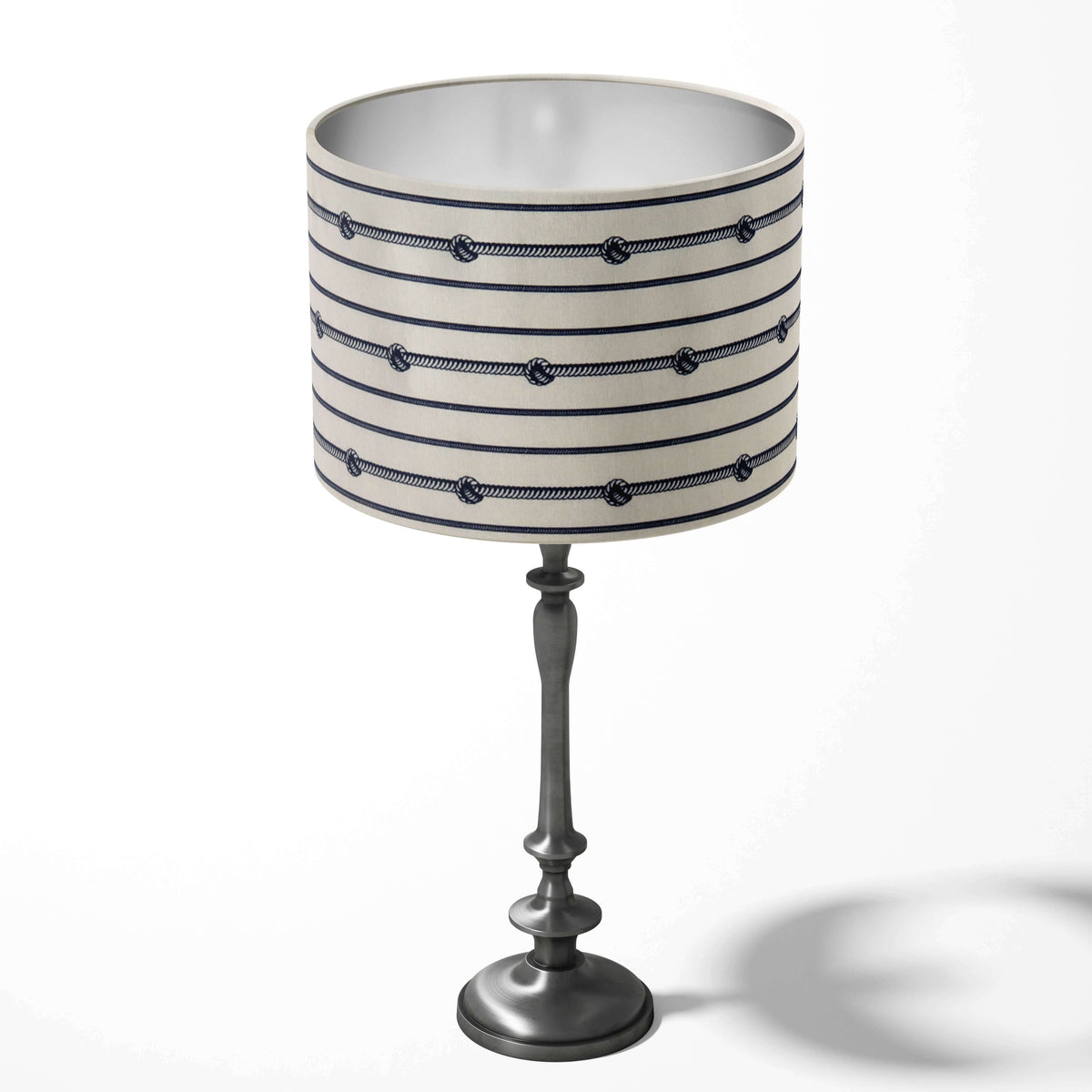 Navy blue and white nautical table lampshade with a striped pattern on a white background.