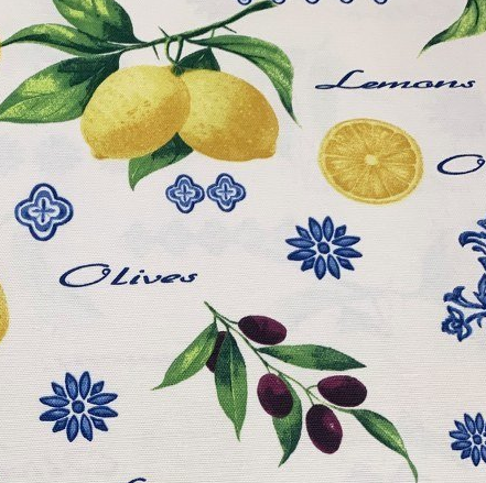 Lemon and olive tree pattern with green leaves and blue decorations printed on white cotton canvas upholstery fabric.